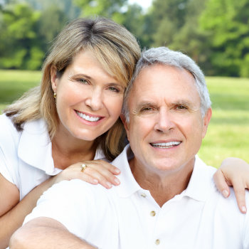 Smiling happy elderly couple