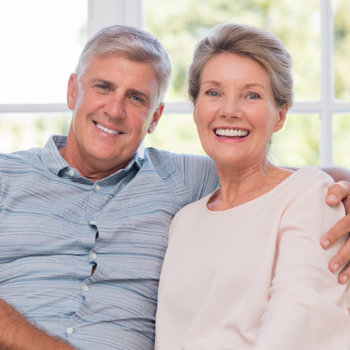 Smiling senior woman and man