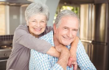Older Couple Smiling After Restorative Dentistry in Mayfield Heights OH