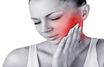 Young Woman with Jaw Pain